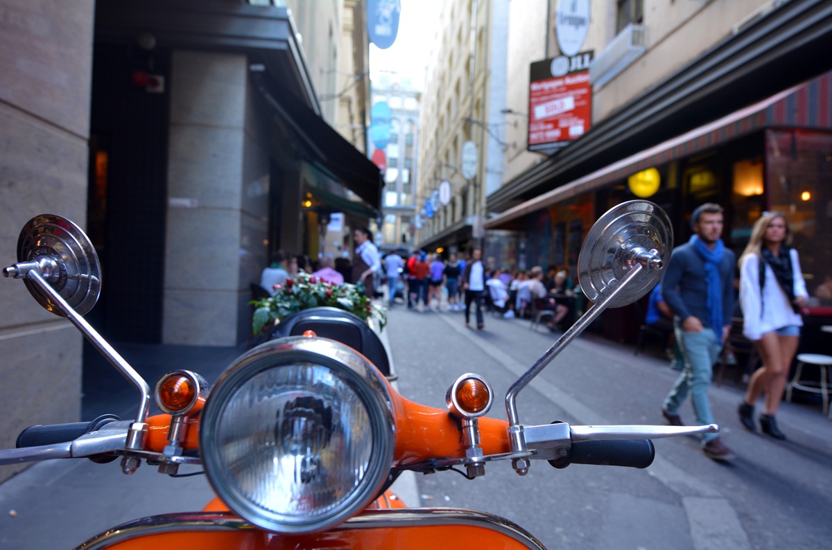 Tourists visiting Degraves Street laneway in Melbourne, lined with cafes and restaurants